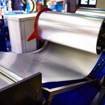 Rolls of sheet metal on industrial equipment